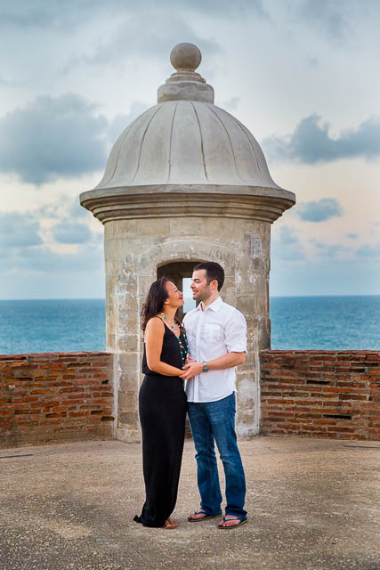 The couple holding each other during their engagement photos at the Castillo San Cristobal in Old San Juan, Puerto Rico.