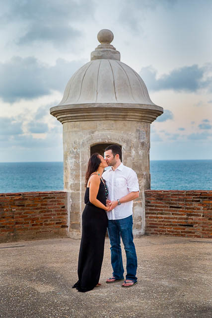 The couple holding each other during their engagement photos at the Castillo San Cristobal in Old San Juan, Puerto Rico.