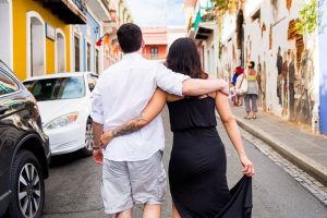 Stylish engaged couple walking in Old San Juan, Puerto Rico.