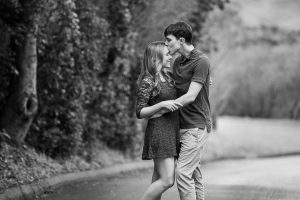 A couple at their engagement photos at the Hans Christian Andersen Park in Solvang, California.