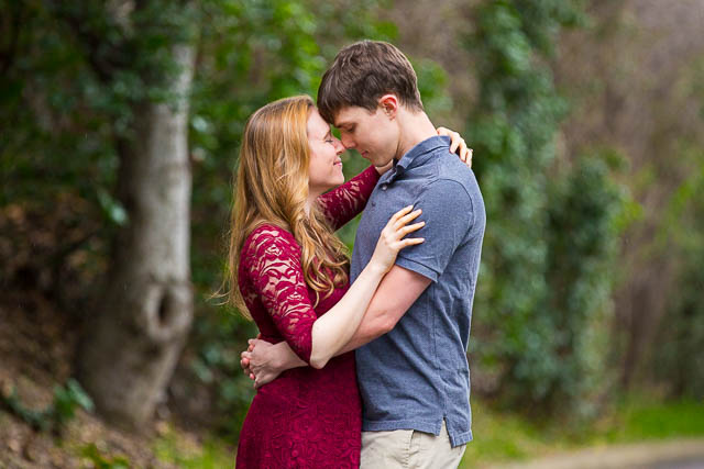 A couple at their engagement photos at the Hans Christian Andersen Park in Solvang, California.