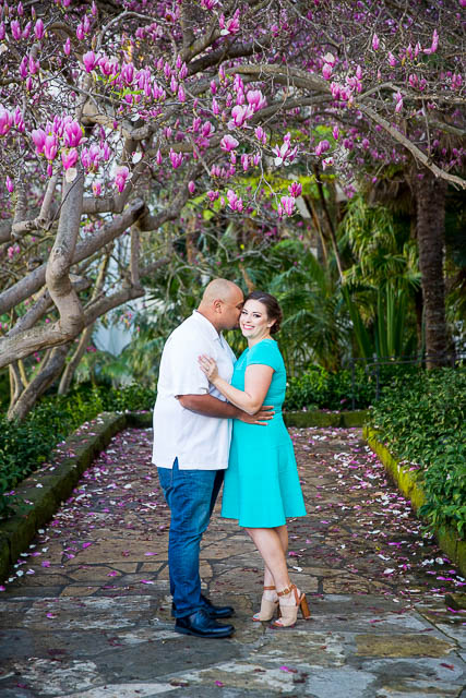 Newly engaged couple posing for their engagement photos at the Santa Barbara County Courthouse in Santa Barbara, CA.