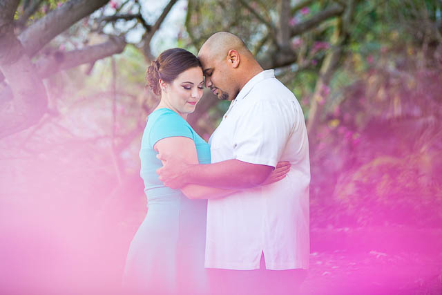 Newly engaged couple posing for their engagement photos at the Santa Barbara County Courthouse in Santa Barbara, CA.