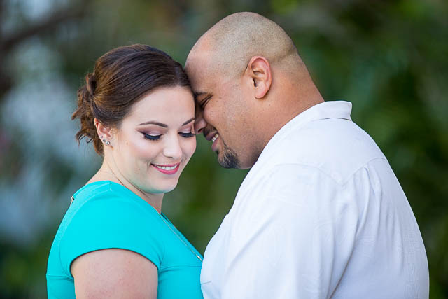 Newly engaged couple posing for their engagement photos at the Santa Barbara County Courthouse in Santa Barbara, CA.