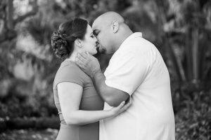 Newly engaged couple posing for their engagement photos at the Santa Barbara County Courthouse in Santa Barbara, CA.