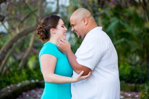 Newly engaged couple posing for their engagement photos at the Santa Barbara County Courthouse in Santa Barbara, CA.