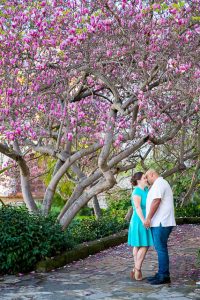 Newly engaged couple posing for their engagement photos at the Santa Barbara County Courthouse in Santa Barbara, CA.