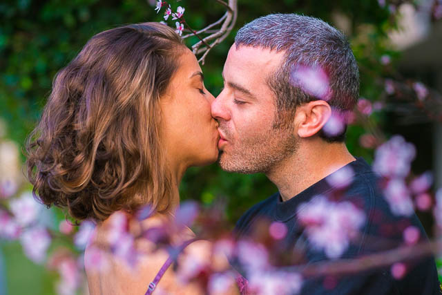 Couple kissing at the Yarkon Park in Tel Aviv, Israel.