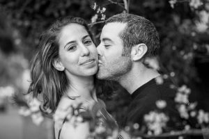 Couple kissing at the Yarkon Park in Tel Aviv, Israel.