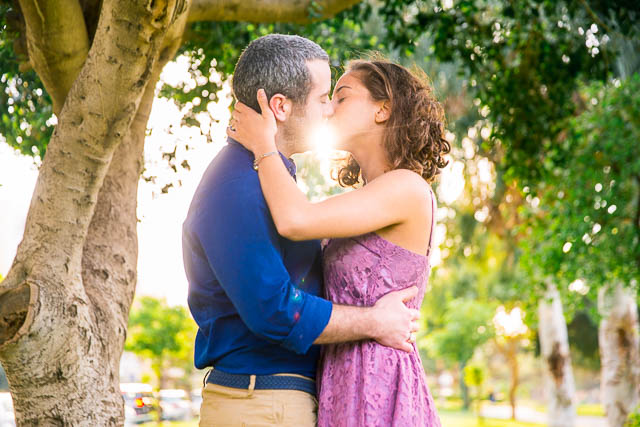 Couple kissing at the Yarkon Park in Tel Aviv, Israel.