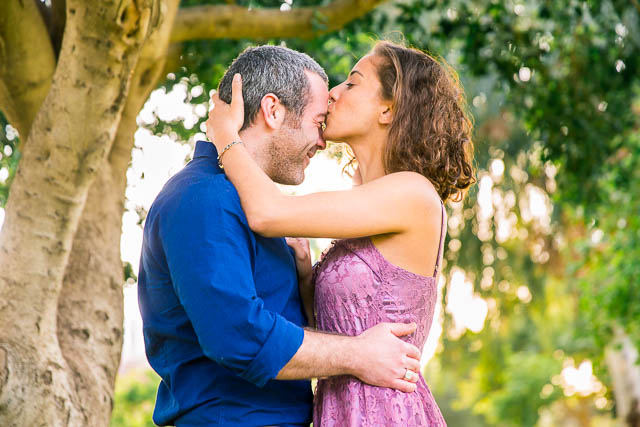 Couple kissing at the Yarkon Park in Tel Aviv, Israel.