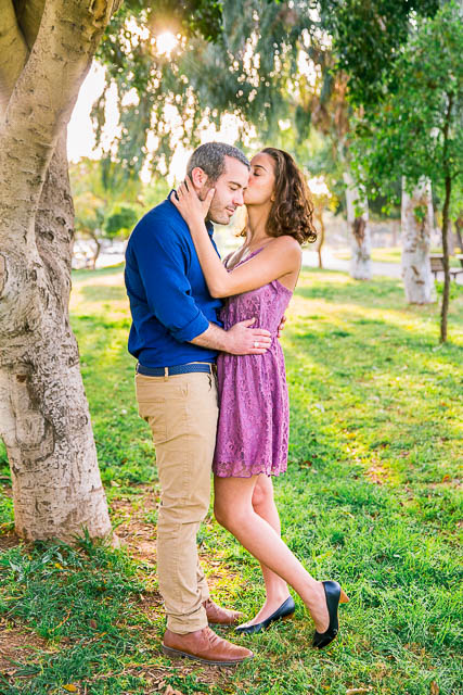 Couple kissing at the Yarkon Park in Tel Aviv, Israel.