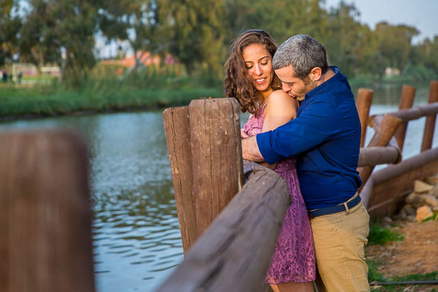 Couple kissing at the Yarkon River in Tel Aviv, Israel.