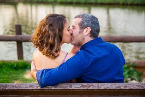 Couple kissing at the Yarkon River in Tel Aviv, Israel.