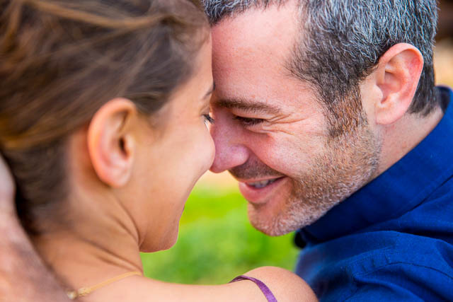 Candid photo of the engaged couple at the Yarkon River in Tel Aviv, Israel.
