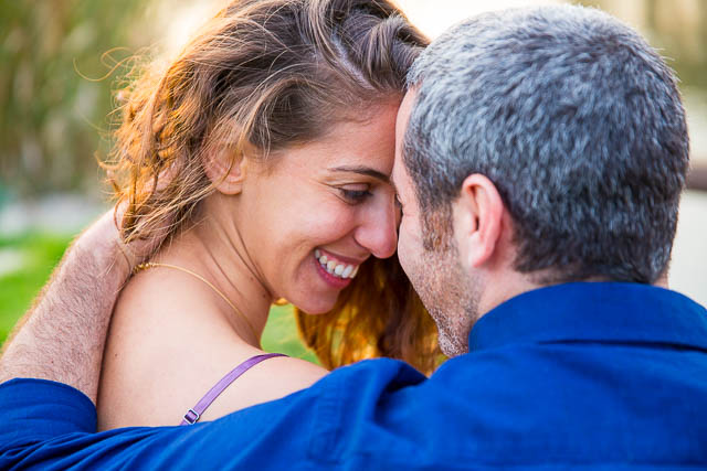 Candid photo of the engaged couple at the Yarkon River in Tel Aviv, Israel.
