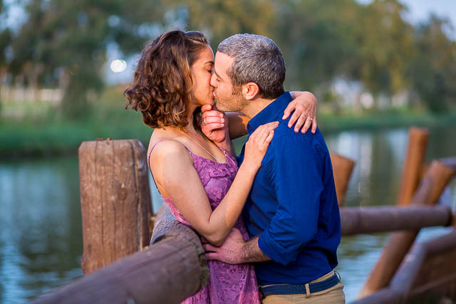 Couple kissing at the Yarkon River in Tel Aviv, Israel.