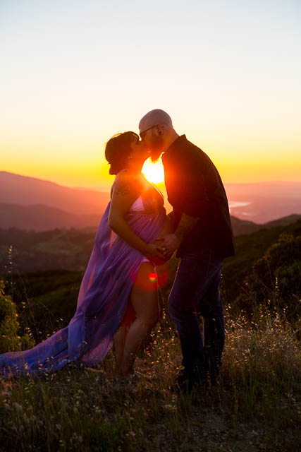 Expectant parents looking over Santa Ynez Valley during their maternity boudoir photoshoot.
