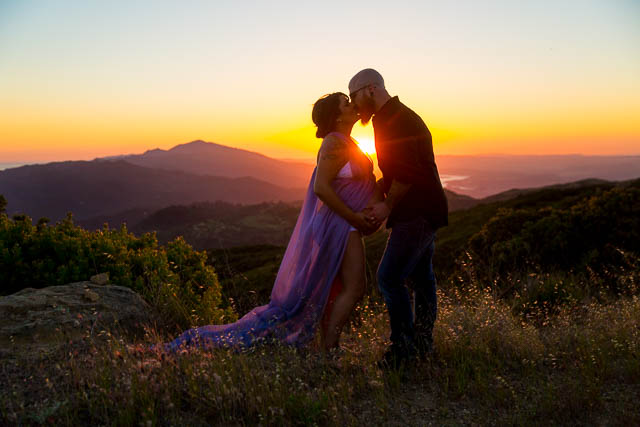 Expectant parents looking over Santa Ynez Valley during their maternity boudoir photoshoot.