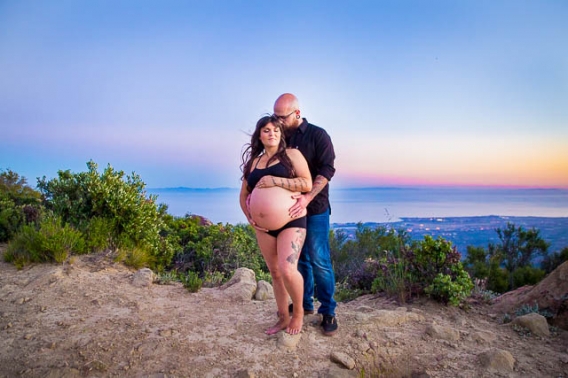 Expectant parents looking over Santa Ynez Valley during their maternity boudoir photoshoot.