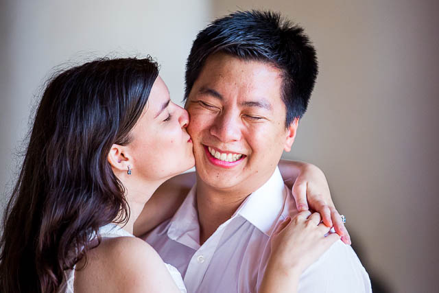 Bride and groom holding each other inside the Santa Barbara Courthouse.