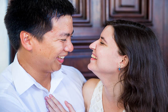 Couple holding each other during Santa Barbara Courthouse engagement photos.