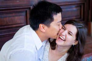 Couple holding each other during Santa Barbara Courthouse engagement photos.
