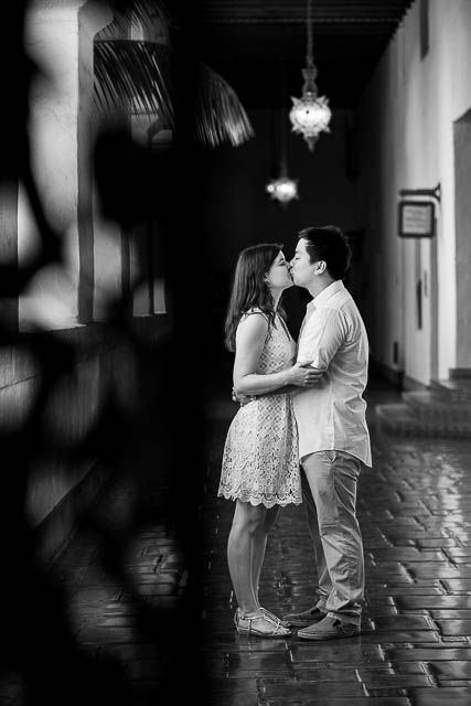 Couple holding each other during Santa Barbara Courthouse engagement photos.