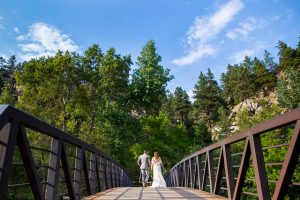 Couple walking on a bridge in Boulder, Colorado.