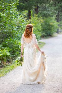 Bride posing on a trail in Boulder, Colorado.