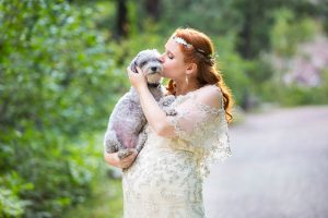 Bride holding her dog during her Boulder, Colorado, wedding.