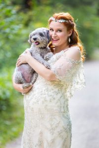 Bride holding her dog during her Boulder, Colorado, wedding.