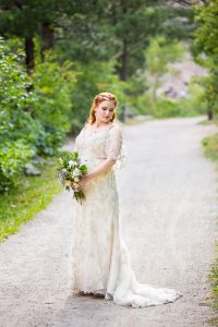 Bride posing on a trail in Boulder, Colorado.