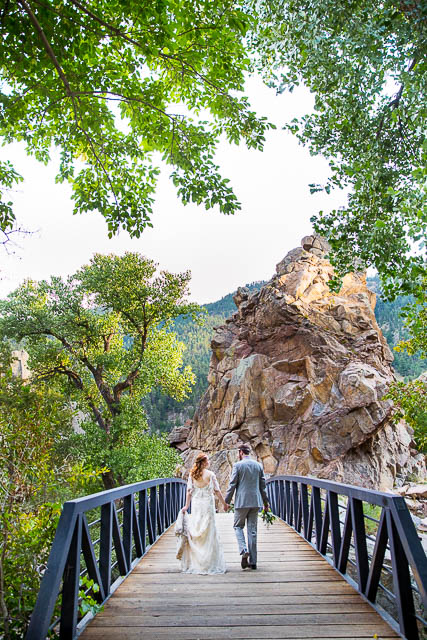 Bride and groom walking together during their Boulder, Colorado, destination wedding photoshoot.