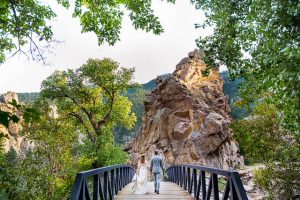 Bride and groom walking together during their Boulder, Colorado, destination wedding photoshoot.