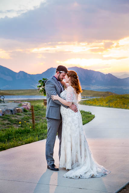 Sunset photos overlooking the Colorado Rockies with bride and groom.