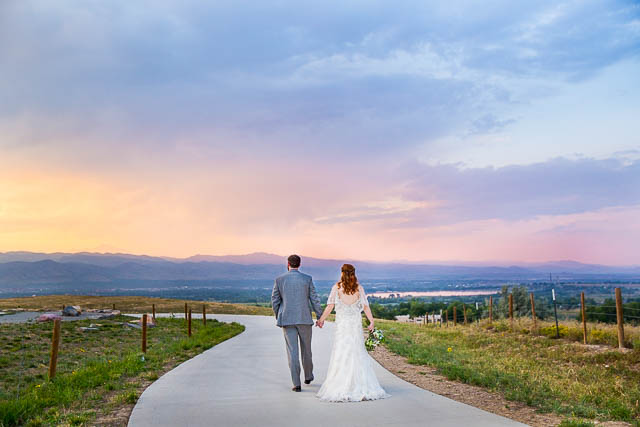 Sunset photos overlooking the Colorado Rockies with bride and groom.