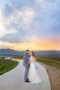 Sunset photos overlooking the Colorado Rockies with bride and groom.