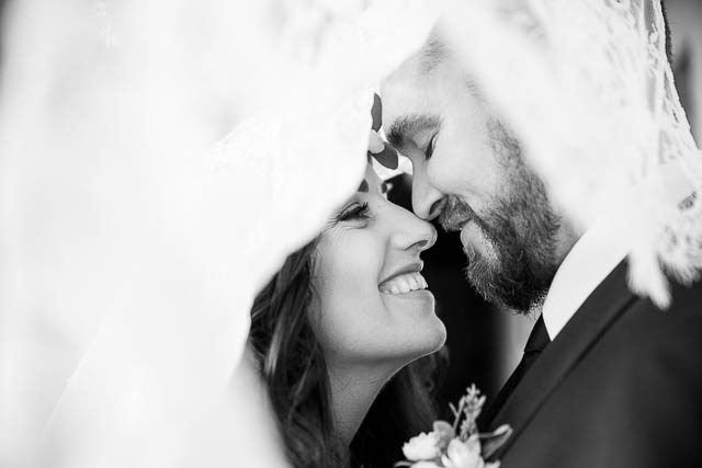 Couple embracing after their Santa Barbara Courthouse elopement.