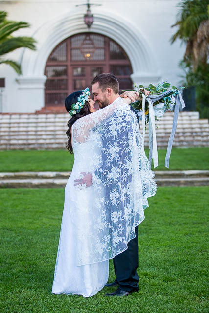 Bride and groom walking around the Santa Barbara Courthouse after their wedding ceremony.