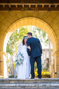 Bride and groom walking around the Santa Barbara Courthouse after their wedding ceremony.