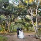 Newlyweds walking around at Ennisbrook trails.