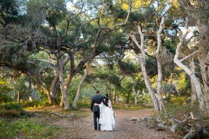 Newlyweds walking around at Ennisbrook trails.