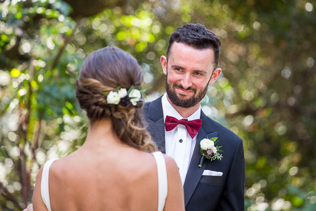 Bride and groom prepare for their first look at Glen Annie Golf Club in Goleta, CA.