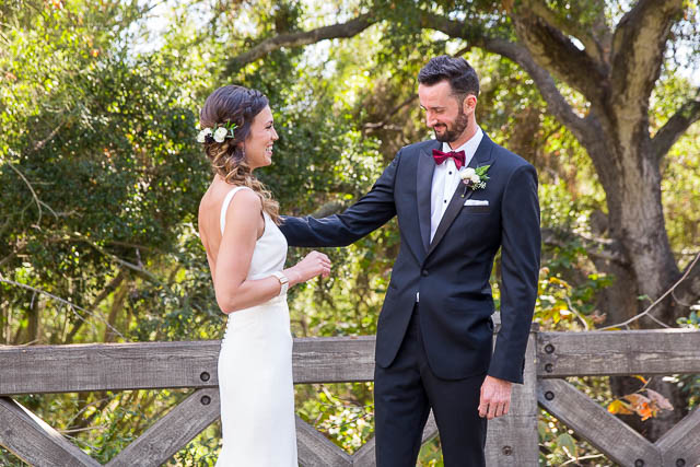 Bride and groom prepare for their first look at Glen Annie Golf Club in Goleta, CA.