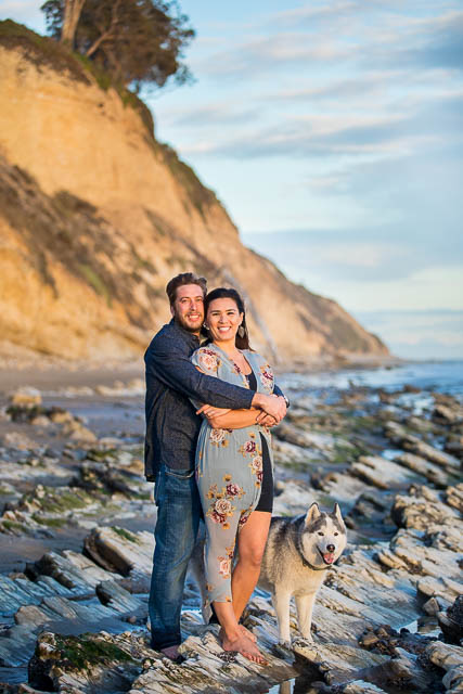 Couple hugging at their Hendry's Beach engagement photoshoot in Santa Barbara, CA.