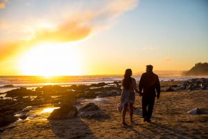 Sunset photos of engaged couple at Hendry's Beach.