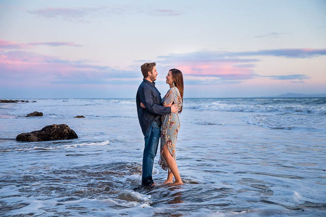 Bride and groom image taken in the water during sunset at their Hendry's Beach engagement photos. 