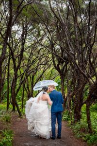 Bride and groom walking together after their Rotorua, New Zealand wedding.