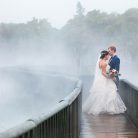 Bride and groom walking around the geothermal Kuirau Park in Rotorua, New Zealand.